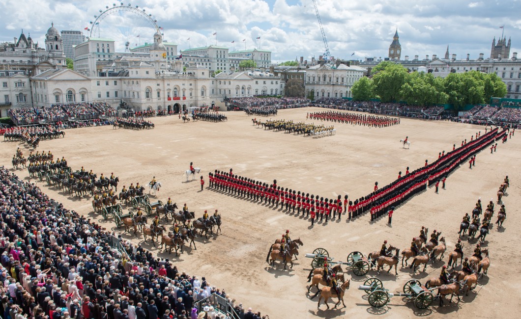 The Queen's Birthday Parade also known as Trooping the Colour, Horse Guards Parade, London, June 2013.

More than a thousand soldiers and horses from the Household Division paraded in front of their Colonel in Chief, Her Majesty The Queen, 15th June 2013, with the immaculate precision, colour and pageantry that marks them as truly World Class.   

Later as the last shot of a 41 gun Royal Salute was fired from The Green Park to mark The Queen's Official Birthday, the skies roared with an impressive fly past from the RAF featuring 32 aircraft of 13 different types.

The centuries old tradition of Trooping The Colour has been held on Horse Guards Parade to honour the Sovereign's Birthday almost annually since 1805.  Each year the Five Foot Guards Regiments take it in turns to Troop their Colour in front of the Sovereign.  Colour is the name given to regimental flags of the British Army, and were used as rallying points as long ago as the Kings of Babylon.  

In the Middle Ages, each Lord or Baron flew his banner as a sign by which his followers could distinguish him in battle. Colours were last carried into action by the 58th Foot in South Africa in 1881.  Up to that time they participated in all the varying fortunes of their Regiment; were often torn by enemy fire and acquired an almost religious significance.  

Even today, uncased Colours are invariably carried by an officer and accompanied by an armed escort.

This year, the Colour being trooped in the presence of Her Majesty The Queen, was that of the 1st Battalion Welsh Guards.  The Welsh Guards have recently returned from operational service in Afghanistan where they worked as part of the Afghan Police Advisory Team assisting the country to achieve self governance. The Field Officer in Brigade Waiting, Lieutenant Colonel Dino Bossi, Welsh Guards, commanded the Parade.